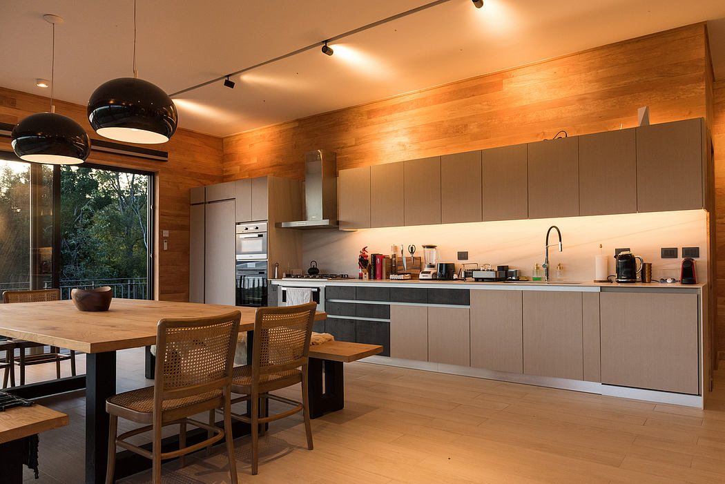 Contemporary kitchen with wood accents and pendant lighting.