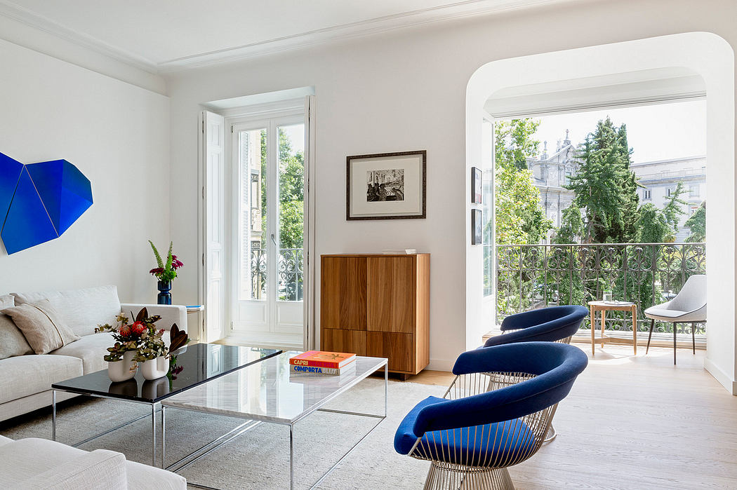 Bright, airy living space with sleek furniture and an arched doorway.