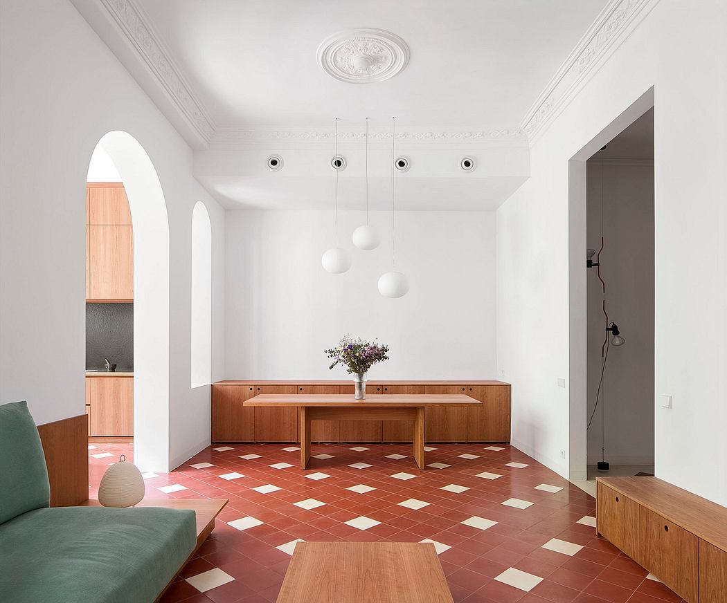 Minimalist interior with white walls, archway, and checkered floor.