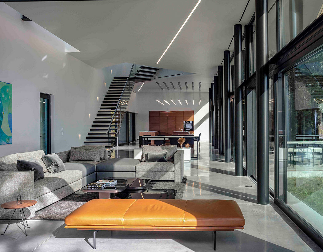 Sleek living space with large windows and minimalist decor.