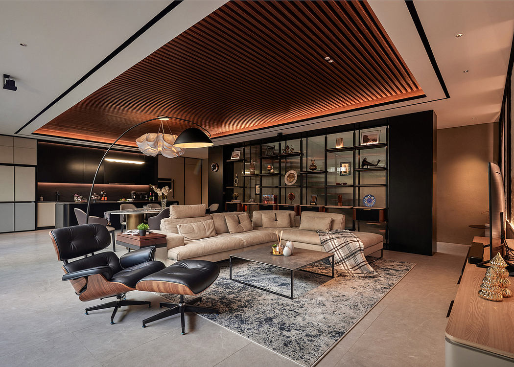 Modern living room with a sectional sofa, Eames chair, and wooden ceiling design