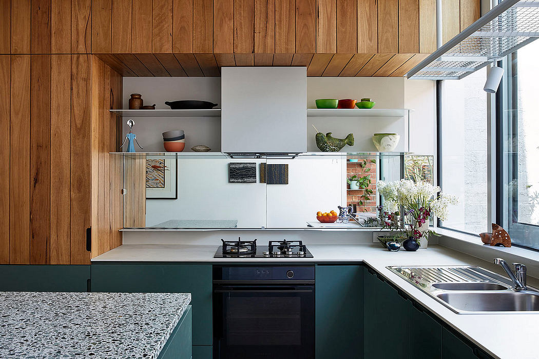 Modern kitchen with wooden cabinets and terrazzo countertop.