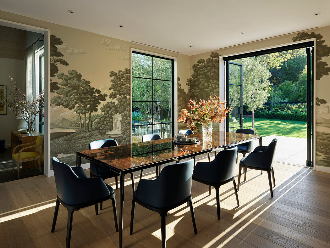 Contemporary dining room with mural wallpaper and garden view.