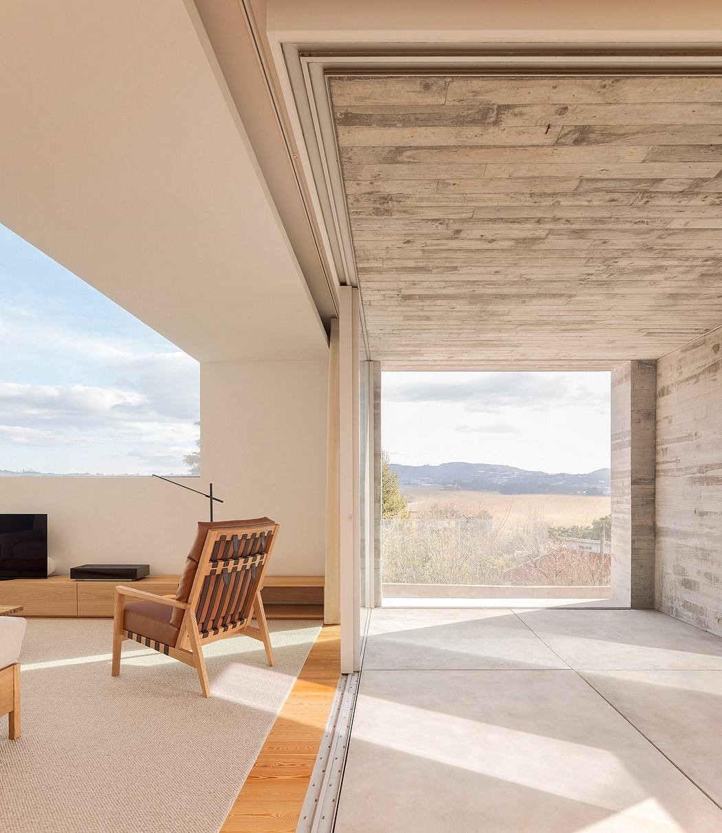 Minimalist interior with wood accents and expansive view.