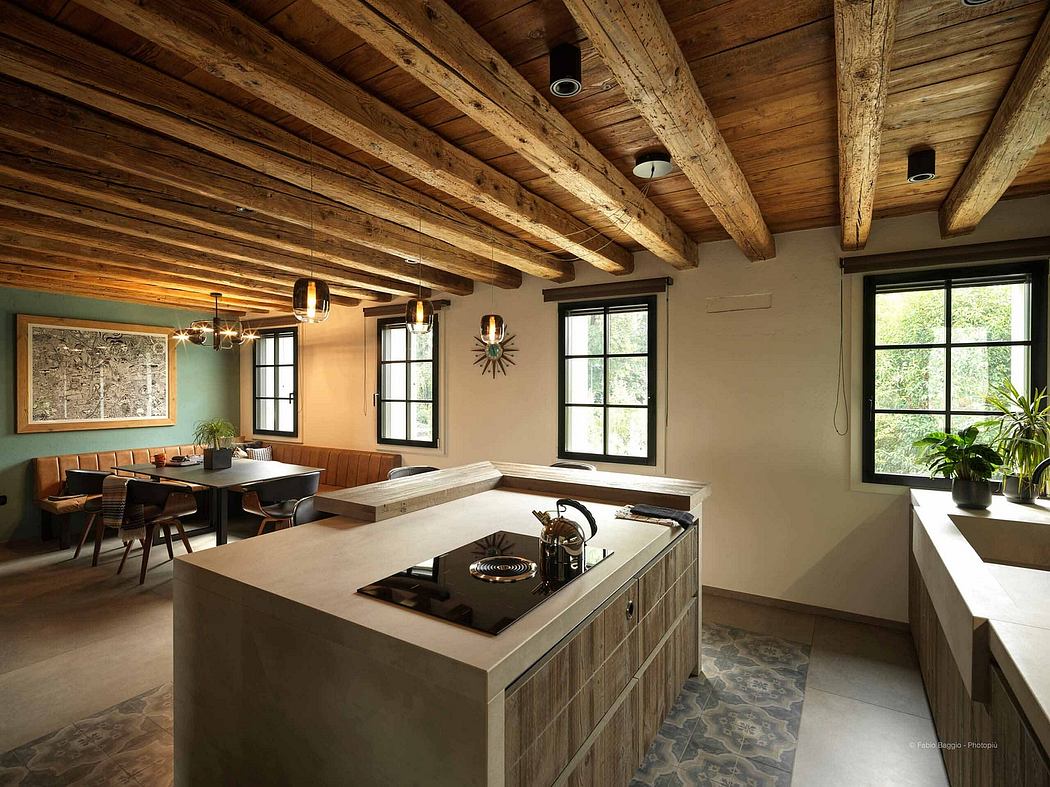 Rustic kitchen with exposed beams and concrete island