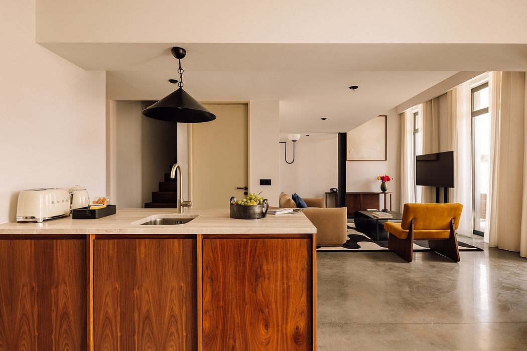 Modern open-plan kitchen and living area with elegant minimalist design.