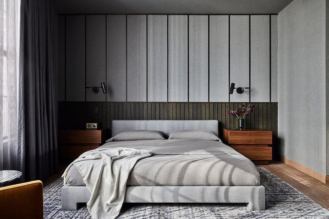 Contemporary bedroom with a minimalist design, neutral tones, and wood accents.
