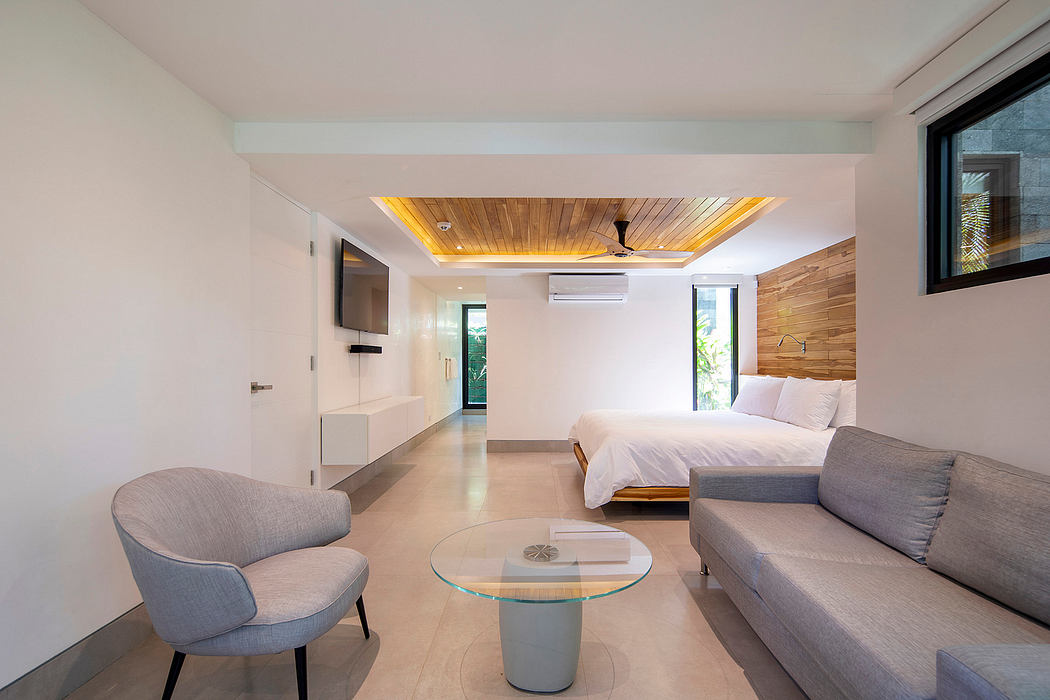 Modern bedroom with wooden ceiling, white walls, and minimalist furniture.