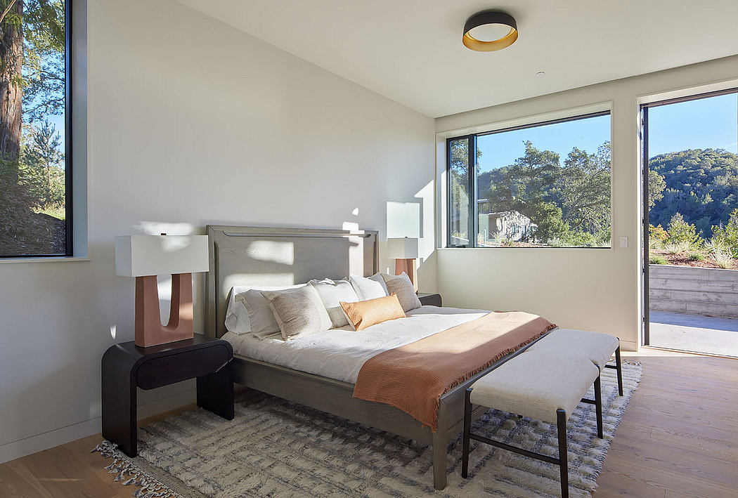Contemporary bedroom with large windows and minimalist decor.