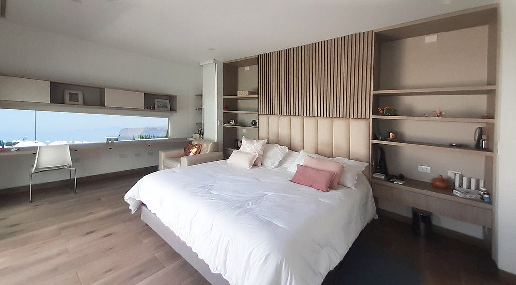 Contemporary bedroom with sleek design and panoramic view.