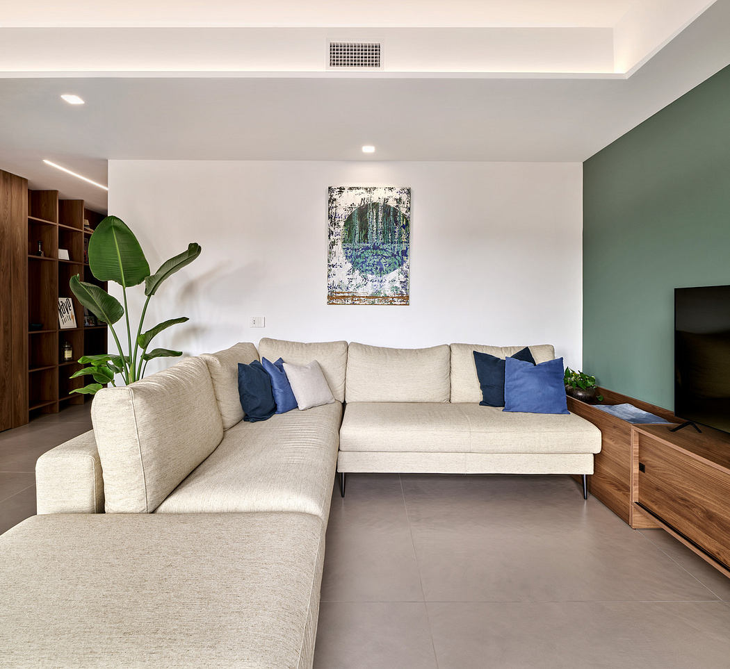 Contemporary minimalist living room with L-shaped sofa and wooden accents.