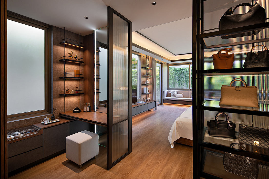 Elegant walk-in closet with glass doors and wood accents.