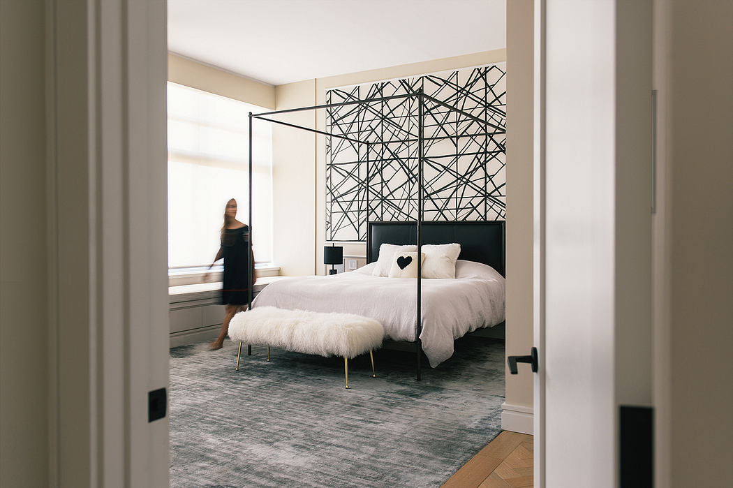 Contemporary bedroom with geometric headboard and minimalist decor.