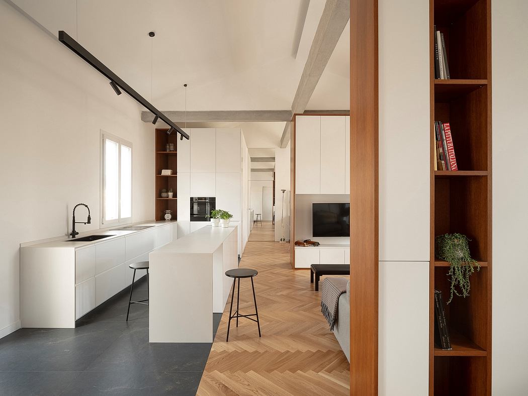 Minimalist interior with herringbone wood floors, white cabinetry, and exposed