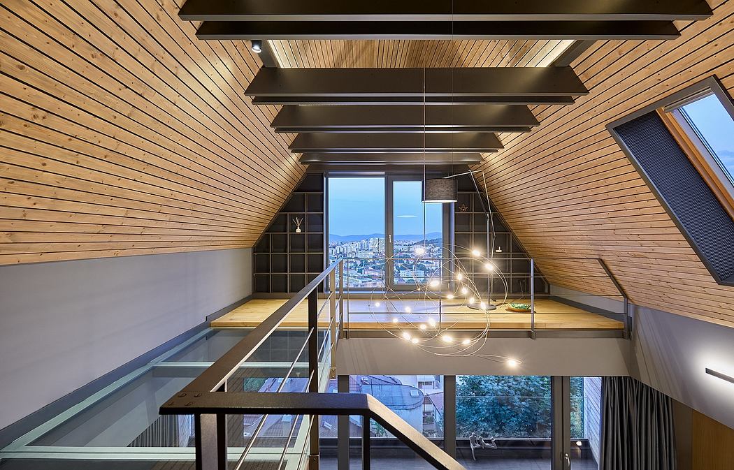 Contemporary interior with wood paneling, glass walls, and staircase.