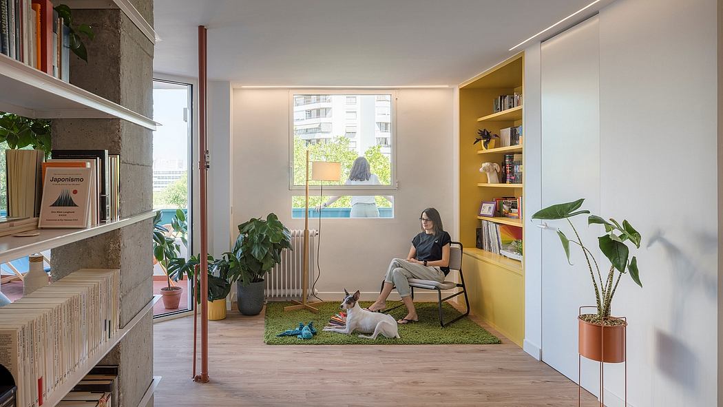 Modern room with a person reading, bright yellow bookshelf, plants, and a