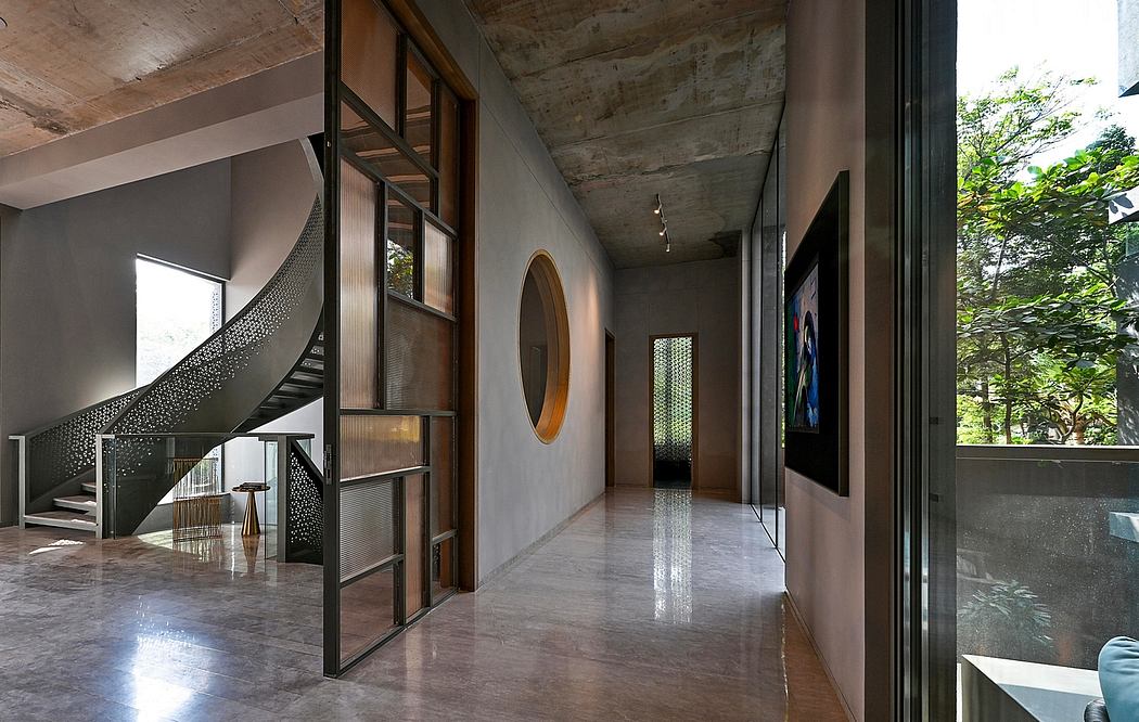 Modern interior with spiral staircase and concrete walls.