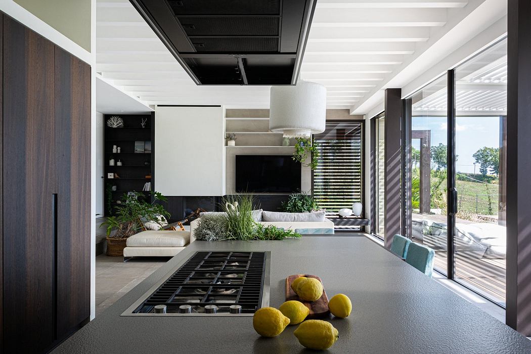 Contemporary kitchen with sleek design and outdoor view.