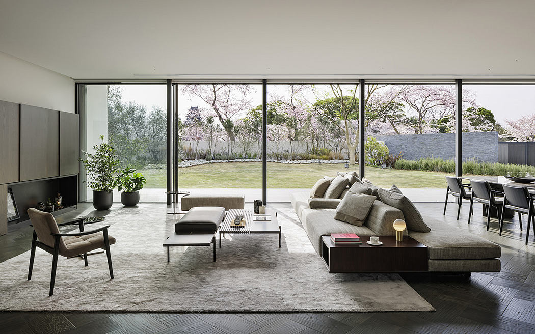 Minimalist interior with large windows and neutral tones.