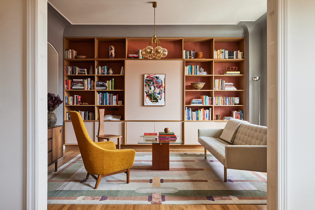 Elegant living room with built-in bookshelves, mid-century furniture, and