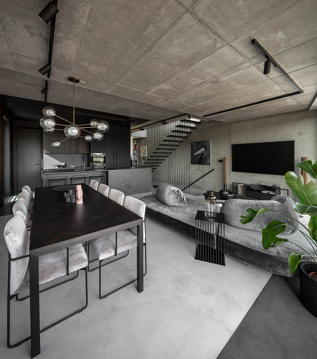 Industrial-chic interior with exposed concrete, sleek furniture, and pendant lights.