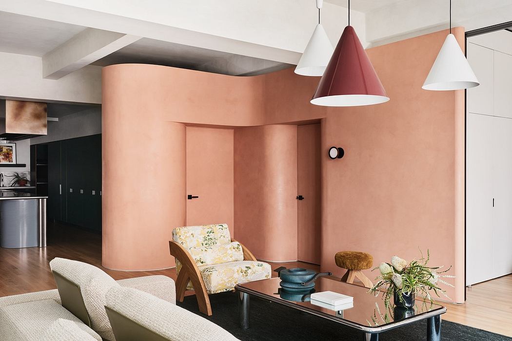 Modern living room with terracotta walls, stylish furniture, and pendant lights.