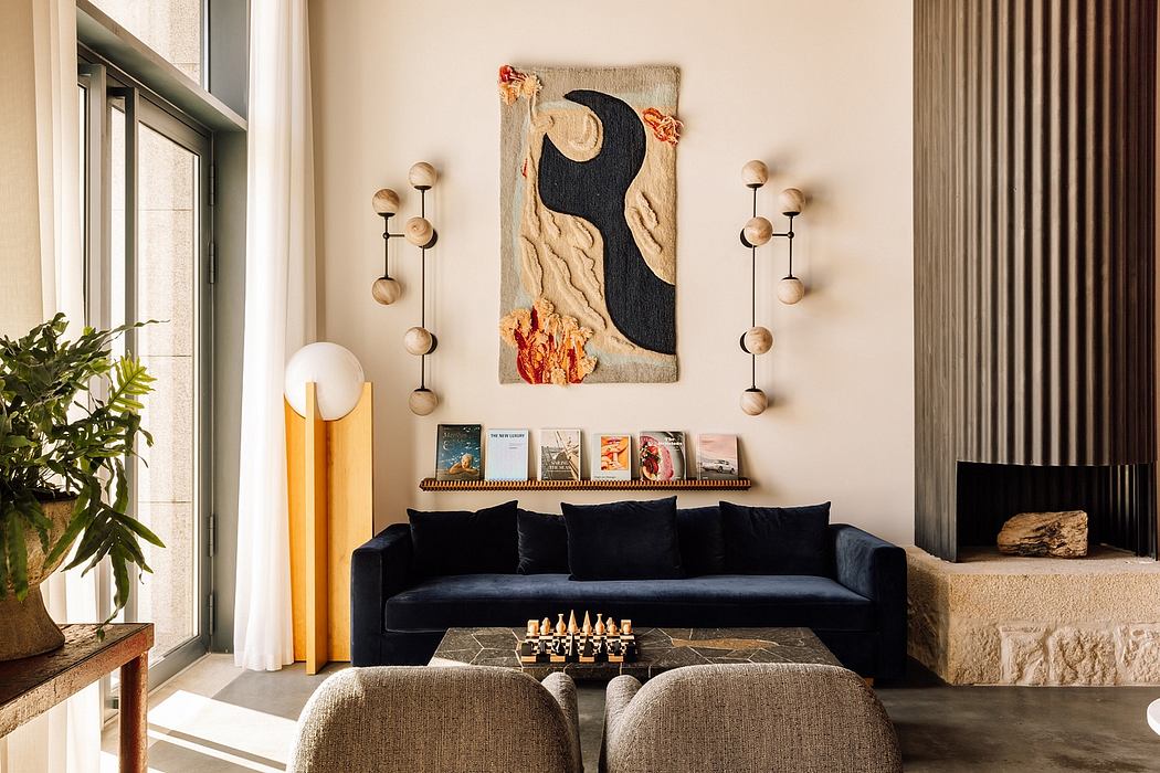 Chic living room with blue sofa, unique wall art, and stylish scon