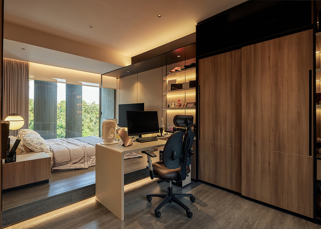 Sleek home office with wooden finishes adjacent to a cozy bedroom.