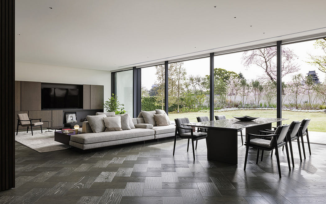 Minimalist interior with neutral tones and expansive glass windows.