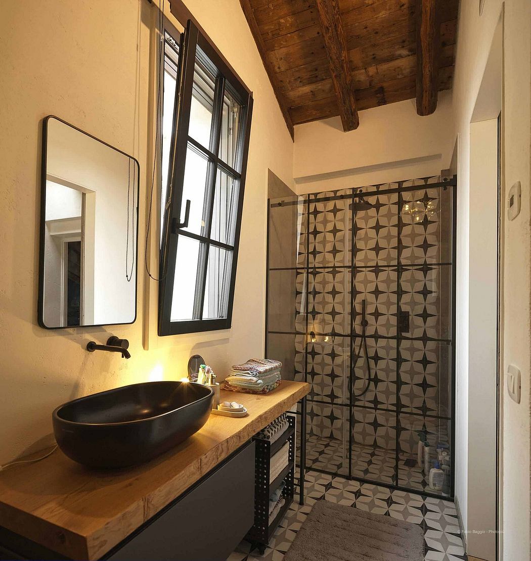 Contemporary bathroom with a patterned shower screen and rustic wooden beams.
