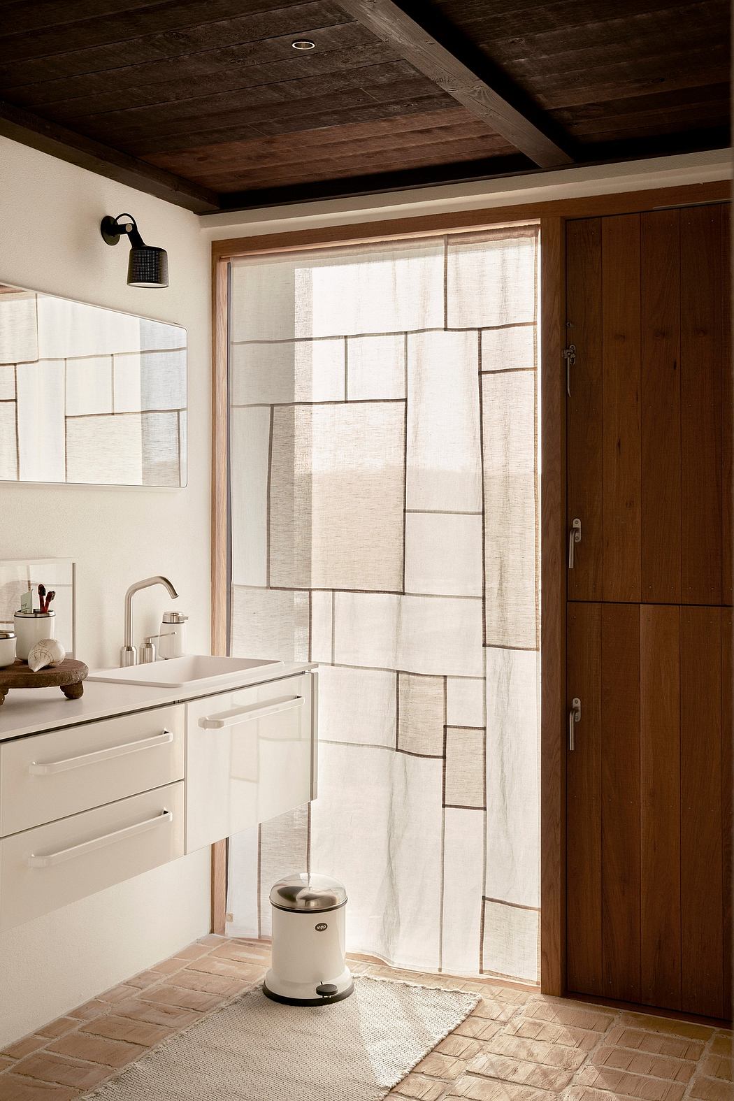 Contemporary bathroom with wood accents and sheer window curtain.