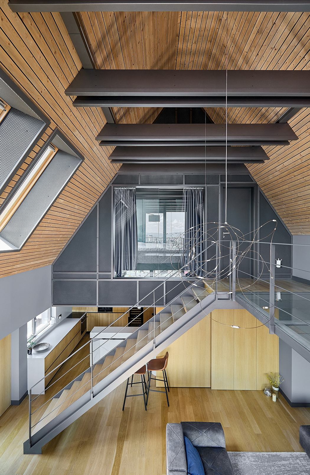 Contemporary loft with wooden ceiling and glass staircase.