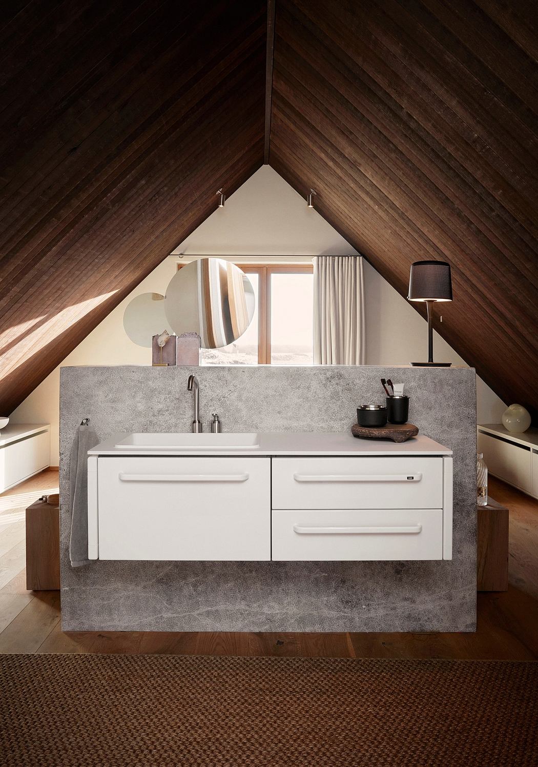 Contemporary attic bathroom with sloped ceiling and minimalist vanity.