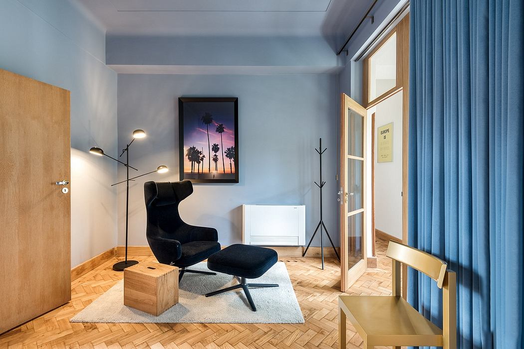 Stylish interior with a black lounge chair, herringbone floor, and