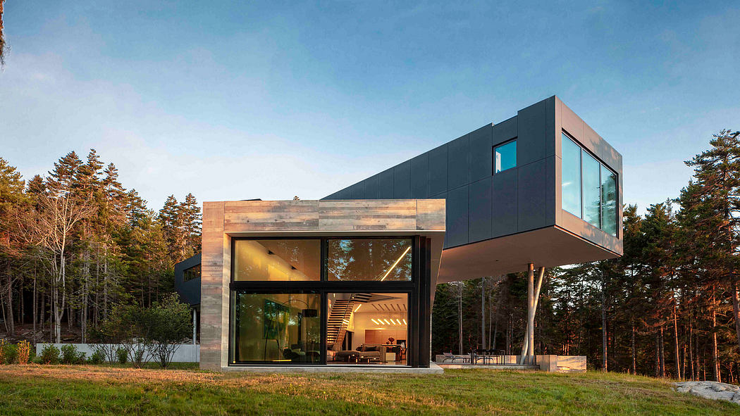 Contemporary house with cantilevered upper level over glass walls.