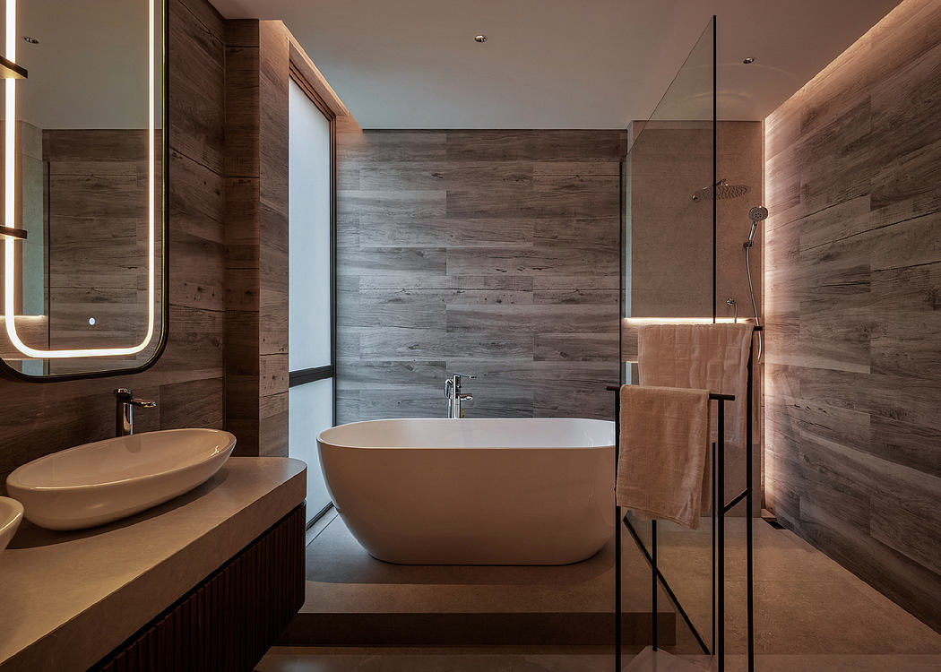 Contemporary bathroom with a standalone tub and wooden accents.