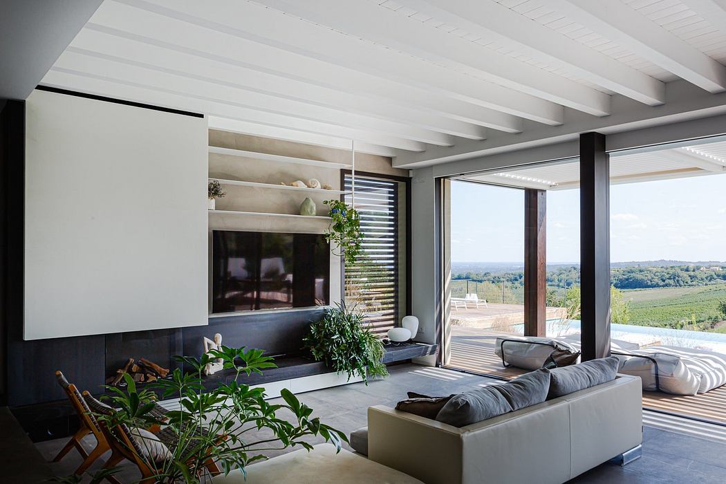 Contemporary living room with panoramic view and minimalist decor.
