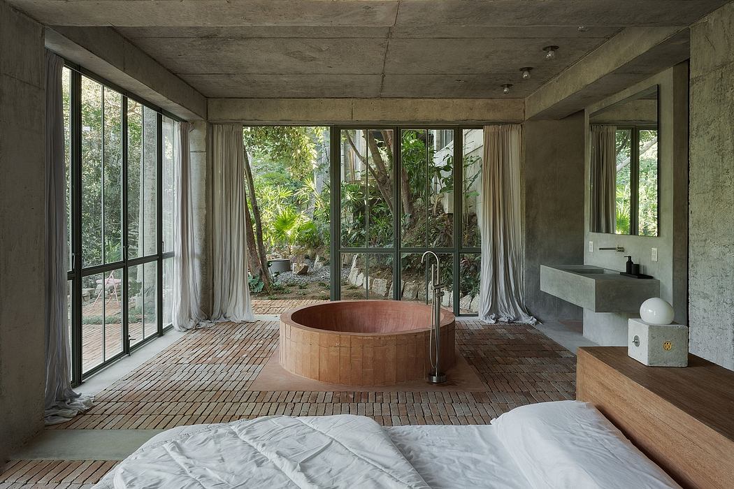 Minimalist bedroom with a wooden tub, concrete walls, and floor-to-ceiling