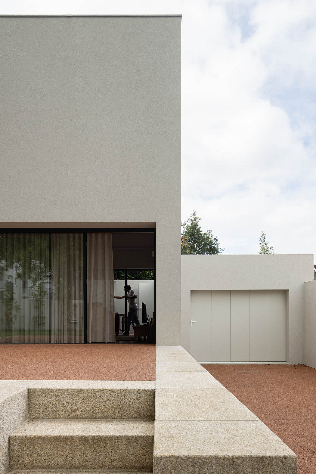Minimalist home exterior with clean lines and neutral tones.