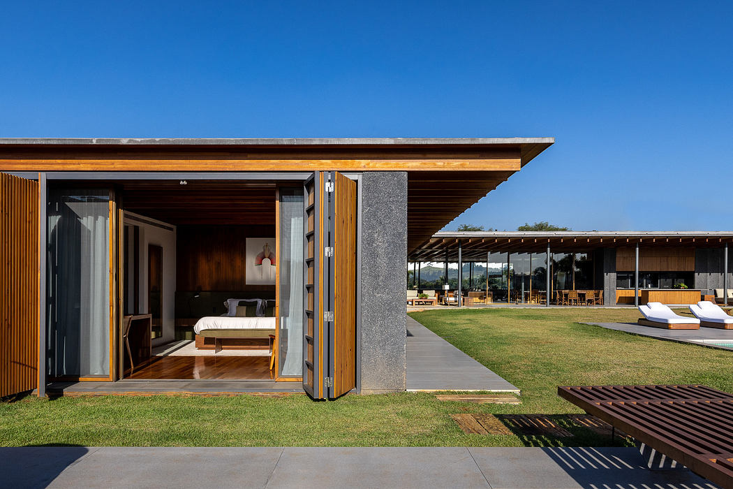 Contemporary house with open sliding door and wooden exterior.