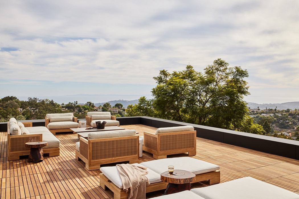 Rooftop patio with modern furniture and scenic view.