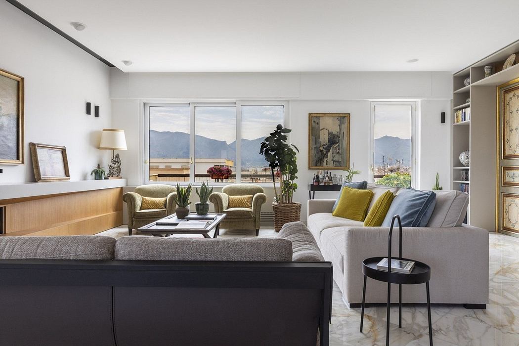 Elegant living room with large windows and mountain view.