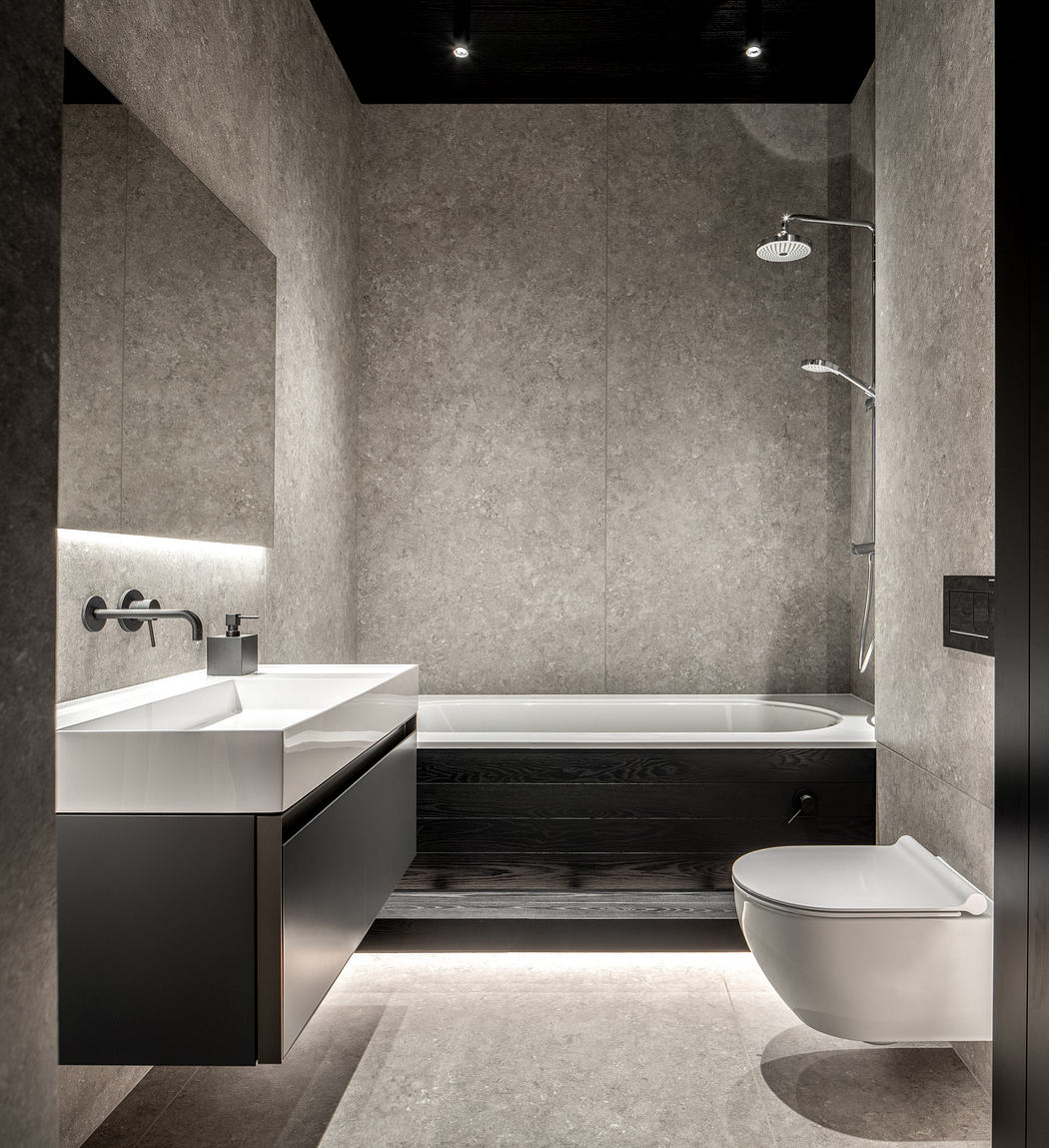Minimalist bathroom with neutral tones and sleek fixtures.