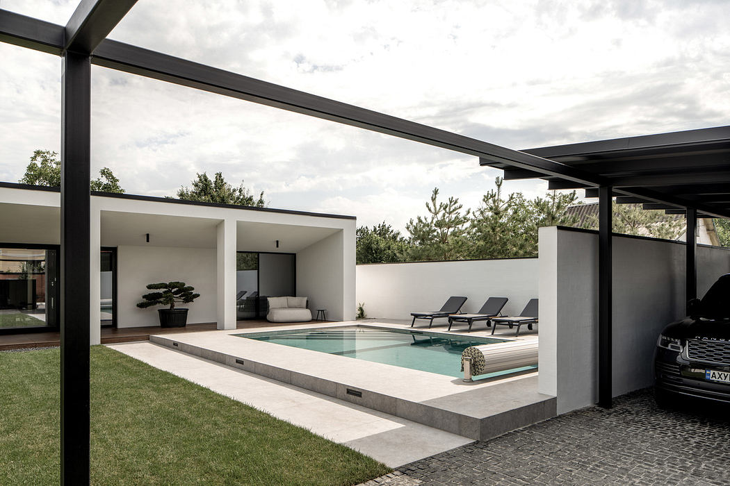 Minimalist home exterior with clean lines and pool.