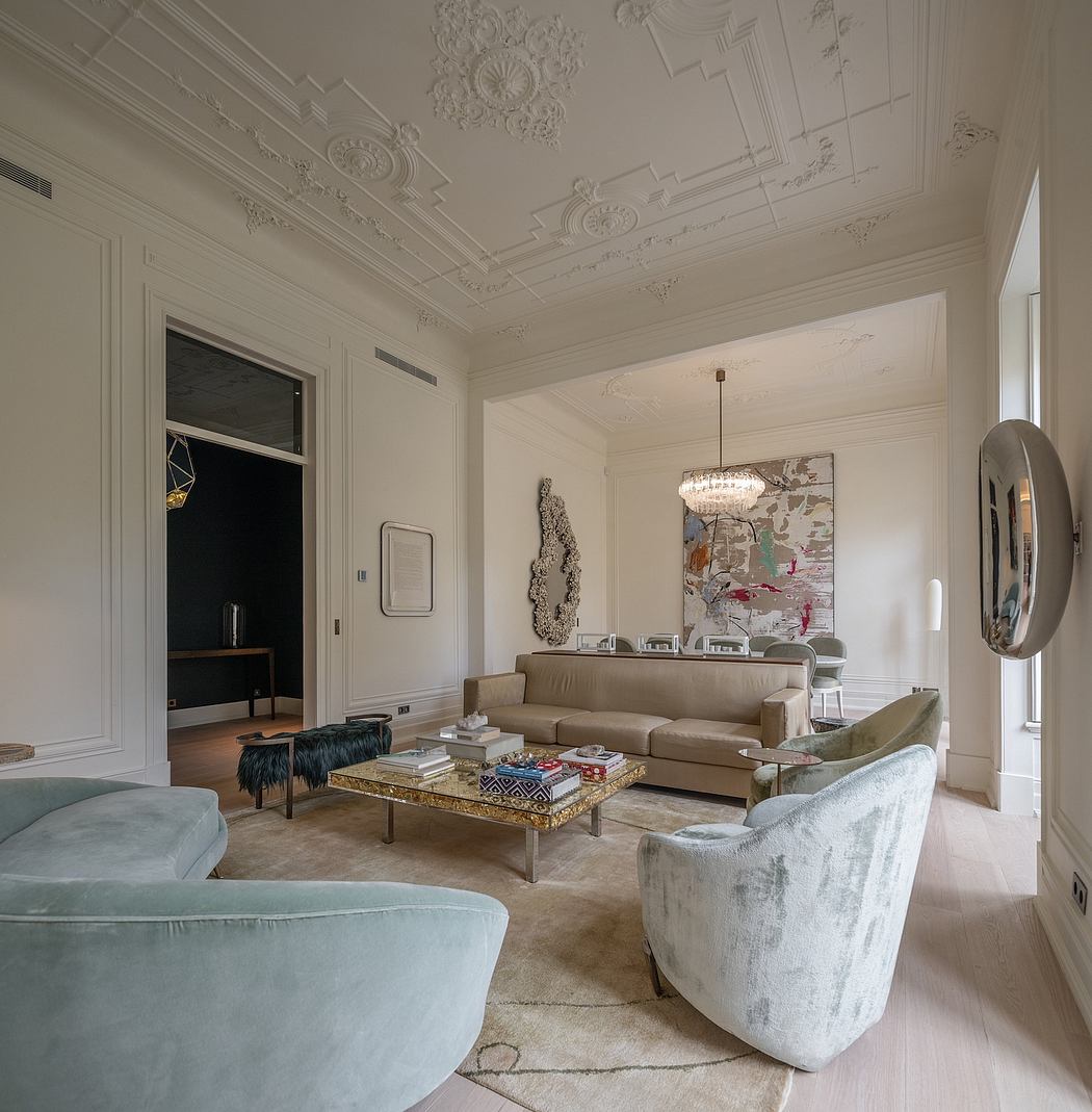 Elegant living room with ornate ceiling and modern furnishings.