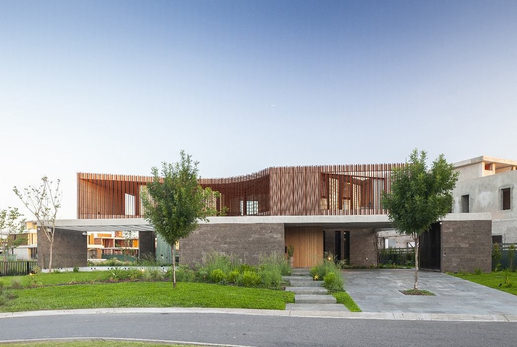 Contemporary house with wooden slat facade and flat roofs