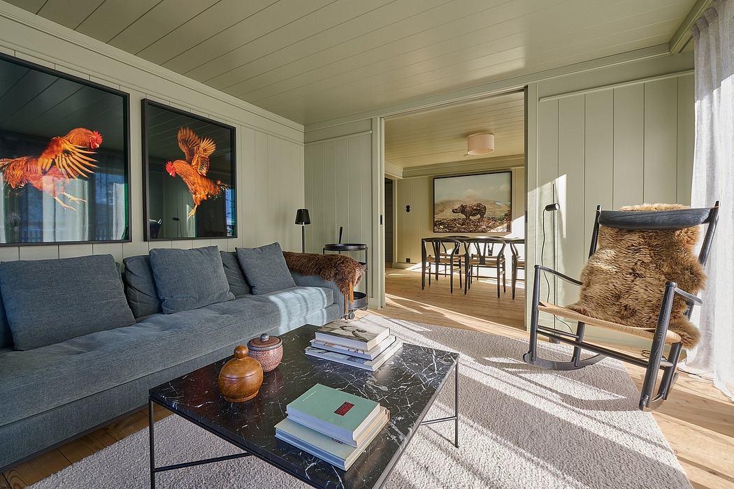 Cozy living room with modern furniture and wooden walls.