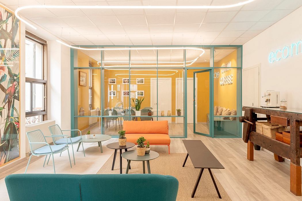 A modern, open-plan office space with vibrant color palette, glass partitions, and stylish furnishings.