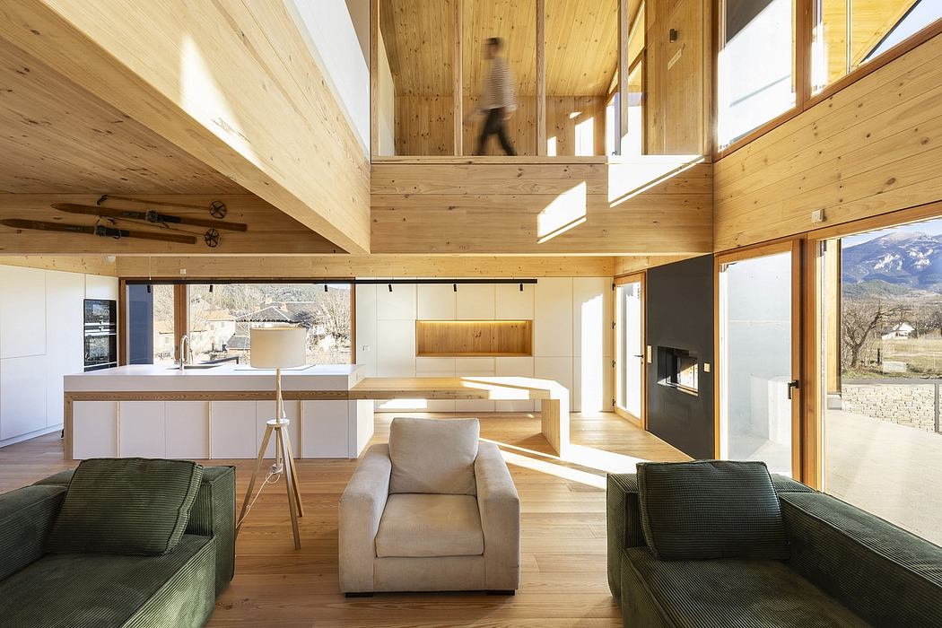 A modern, wood-paneled living space with minimalist furniture, large windows, and a fireplace.