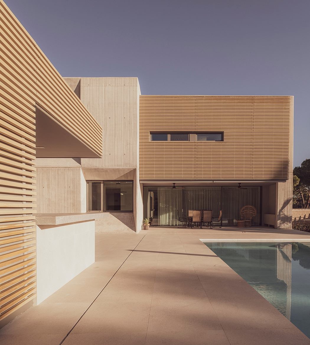 Contemporary house with wooden slats and pool.